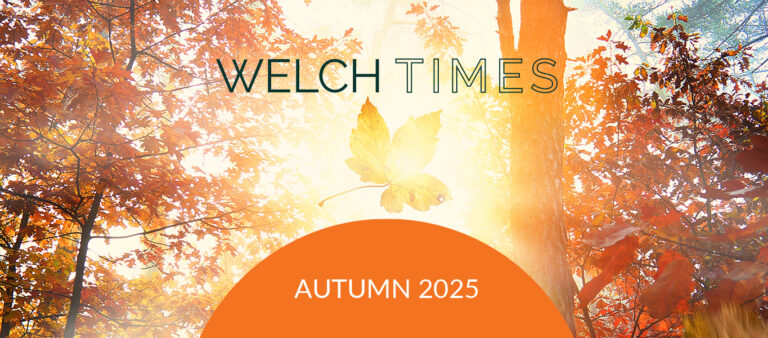 Welch Times, Autumn 2025, with a background of orange autumn trees in the background.